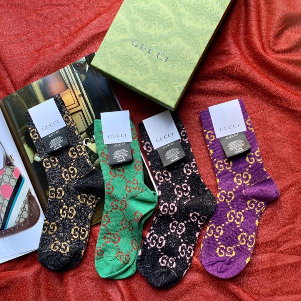 23/4 paia di calzini a tubo medio da donna in filo d'oro Gucci classic GG