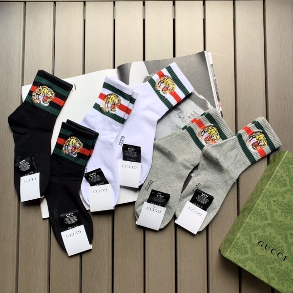 repliche,replica,perfette,siti di,affidabili,migliori siti,dove comprare,1:1,scarpe da ginnastica 23/6 paia di calzini a tubo medio in puro cotone con testa di tigre ricamata in stile classico Gucci