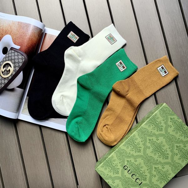 repliche,replica,perfette,siti di,affidabili,migliori siti,dove comprare,1:1,scarpe da ginnastica 23/4 paia di calze Gucci fashion new green frame logo in cotone a tubo medio