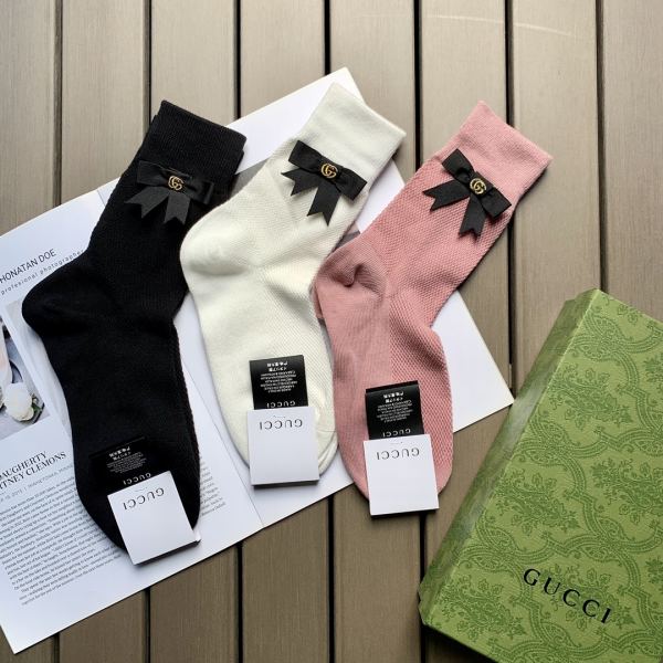 repliche,replica,perfette,siti di,affidabili,migliori siti,dove comprare,1:1,scarpe da ginnastica 23/3 paia di calzini a tubo medio in cotone a rete con fiocco sul sito ufficiale Gucci