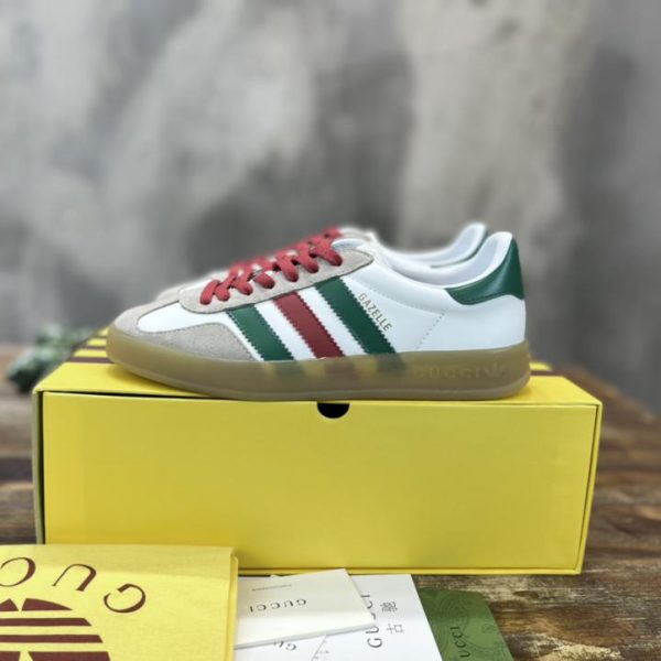 repliche,replica,perfette,siti di,affidabili,migliori siti,dove comprare,1:1,scarpe da ginnastica Versione top delle sneakers Gazelle congiunte adidas x Gucci