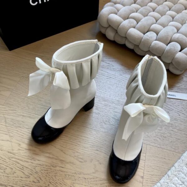 repliche,replica,perfette,siti di,affidabili,migliori siti,dove comprare,1:1,scarpe da ginnastica Stivaletti lunghi con fiocco e tacco grosso Chanel autunno/inverno (601C1)