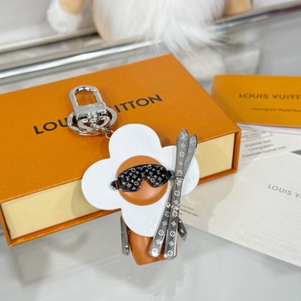 repliche,replica,perfette,siti di,affidabili,migliori siti,dove comprare,1:1,scarpe da ginnastica Nuovo arrivo M1990 Portachiavi in ​​peluche con doppio snowboard e girasole Louis Vuitton Vivian (IYA6V3)
