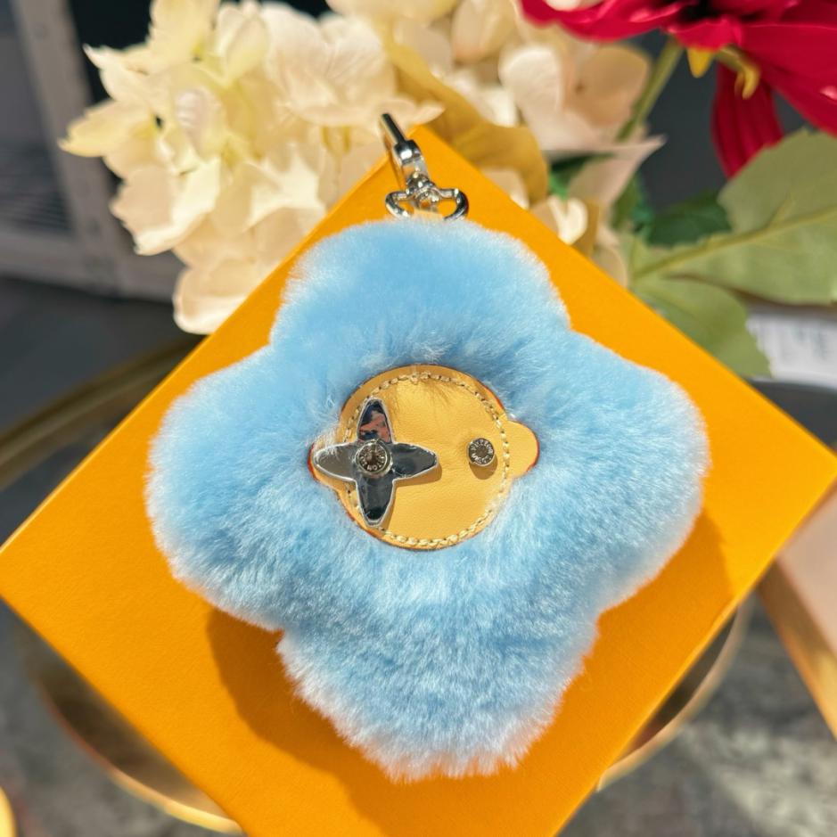 repliche,replica,perfette,siti di,affidabili,migliori siti,dove comprare,1:1,scarpe da ginnastica Nuovo arrivo: portachiavi/ciondolo per borsa LOUIS VUITTON VIVIENNE SHEARLING con pompon a forma di girasole (4DB0D0)