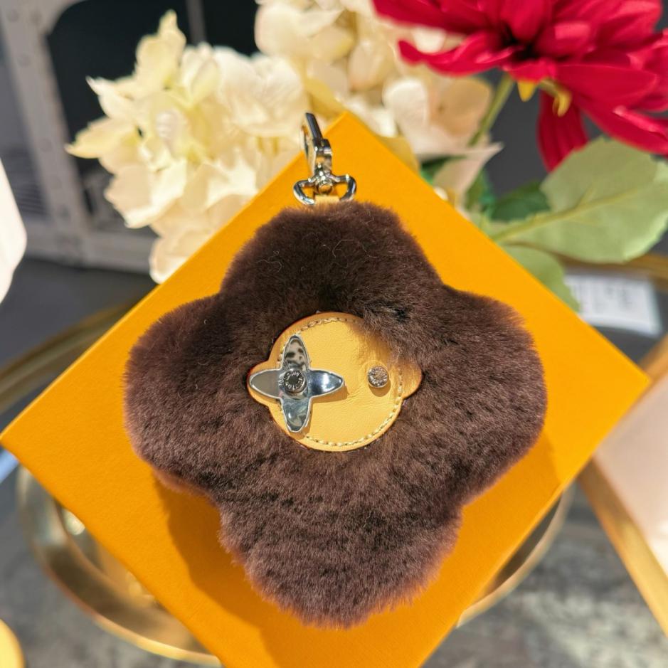 repliche,replica,perfette,siti di,affidabili,migliori siti,dove comprare,1:1,scarpe da ginnastica Nuovo arrivo: portachiavi/ciondolo per borsa LOUIS VUITTON VIVIENNE SHEARLING con pompon a forma di girasole (5N06RD)