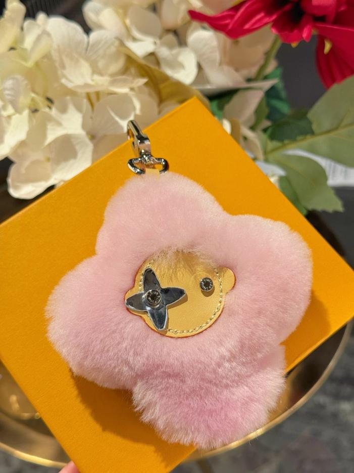 repliche,replica,perfette,siti di,affidabili,migliori siti,dove comprare,1:1,scarpe da ginnastica Nuovo arrivo: portachiavi/ciondolo per borsa LOUIS VUITTON VIVIENNE SHEARLING con pompon a forma di girasole (B2HXTU)